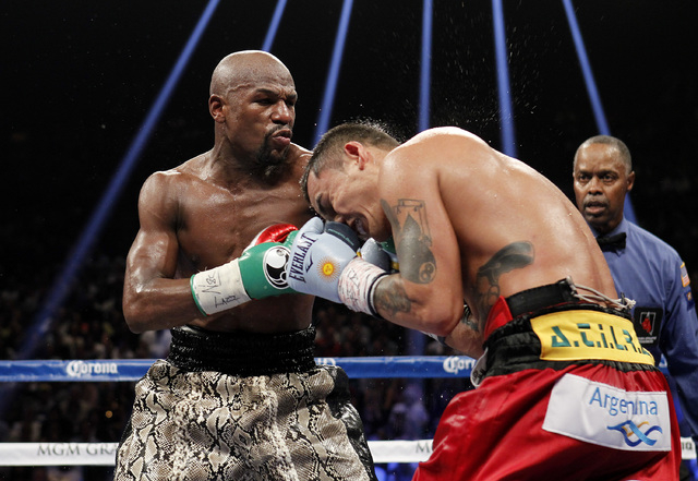 Floyd Mayweather Jr. connects with Marcos Maidana during their WBC/WBA welterweight title fight at the MGM Grand Garden Arena in Las Vegas on Saturday, Sept. 13, 2014. (Sam Morris/Las Vegas Review ...