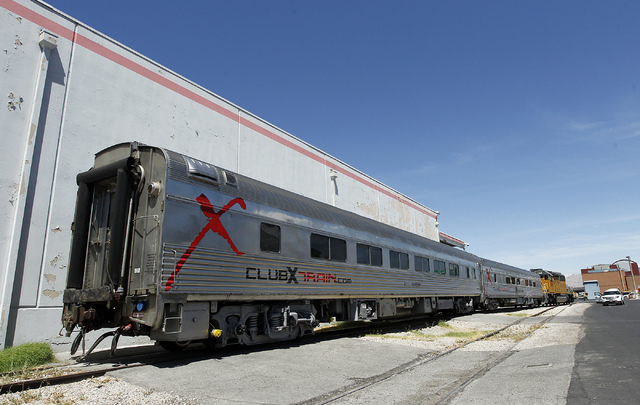 Union Pacific removes a pair of Club X Train cars from the Las Vegas Review-Journal's parking lot near the intersection of MLK Blvd. and Bonanza Rd. in Las Vegas on Thursday, July 24, 2014. (Jason ...