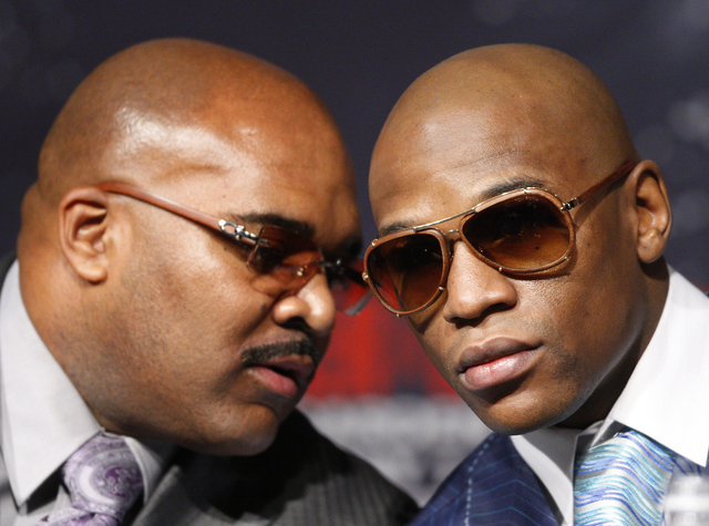 JOHN LOCHER/LAS VEGAS REVIEW-JOURNAL
Floyd Mayweather Jr., right, speaks with Leonard Ellerbe during a press conference at the MGM Grand in Las Vegas Wednesday, April 28, 2010. Mayweather Jr. will ...