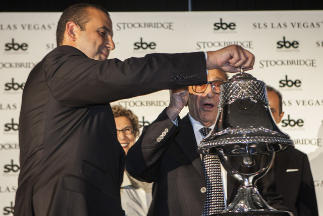 Sam Nazarian, left, CEO of SBE Entertainment,  and his father Yonnes during the ceremonial ringing of the bell at  SLS Las Vegas  on Friday Aug. 22, 2014. (Jeff Scheid/Las Vegas Review-Journal)