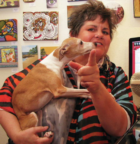 Jana Lynch holds her Italian greyhound Pippi on Aug. 20 at Jana’s RedRoom in The Arts Factory, 107 E. Charleston Blvd. (F. Andrew Taylor/View)