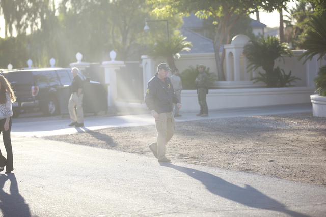 FBI agents investigate while serving a federal search warrant at a home at 4311 E. Oquendo Road in Las Vegas on Monday, Sept. 29, 2014. The FBI did not give any other details other than that no ar ...