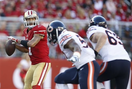 San Francisco 49ers quarterback Colin Kaepernick (7) passes against the Chicago Bears during the first quarter of an NFL football game in Santa Clara, Calif., Sunday, Sept. 14, 2014. (AP Photo/Ton ...