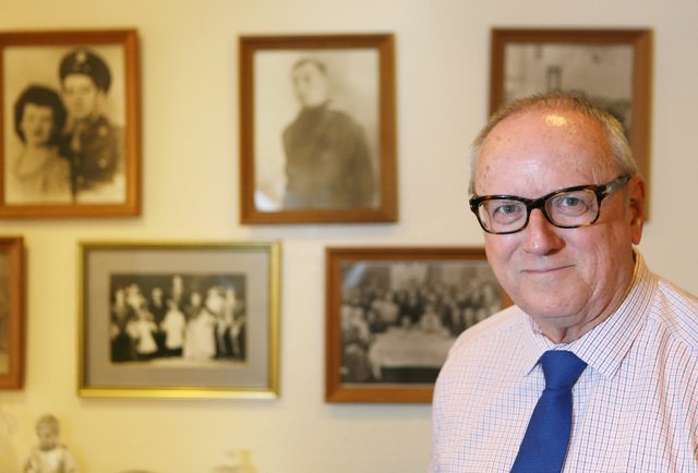 Dr. Ronald Lawrence stands near old family photos hanging in his office at Community Counseling Center of Southern Nevada Monday, Aug. 4, 2014, in Las Vegas. Lawrence founded the counseling center ...