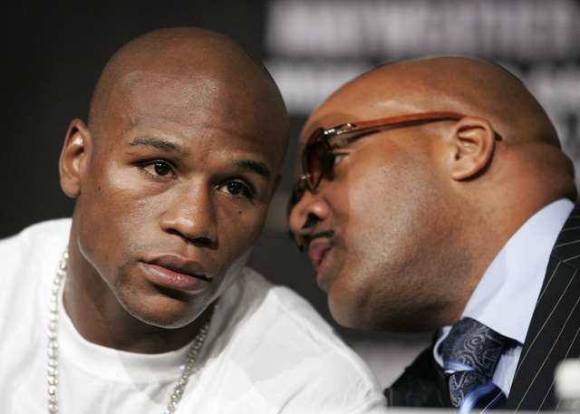 JOHN LOCHER/LAS VEGAS REVIEW-JOURNAL
Floyd Mayweather Jr., left, and Leonard Ellerbe speak during a press conference for the Mayweather vs Marquez fight at the MGM Grand in Las Vegas Wednesday, Se ...