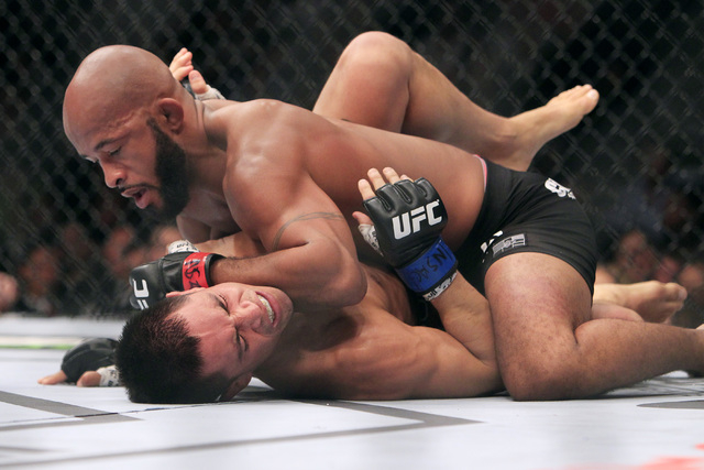 Demetrious Johnson throws an elbow to the head of Chris Cariaso during their fight at UFC 178 Saturday, Sept. 27, 2014 at the MGM Grand Garden Arena in Las Vegas. (Sam Morris/Las Vegas Review-Journal)