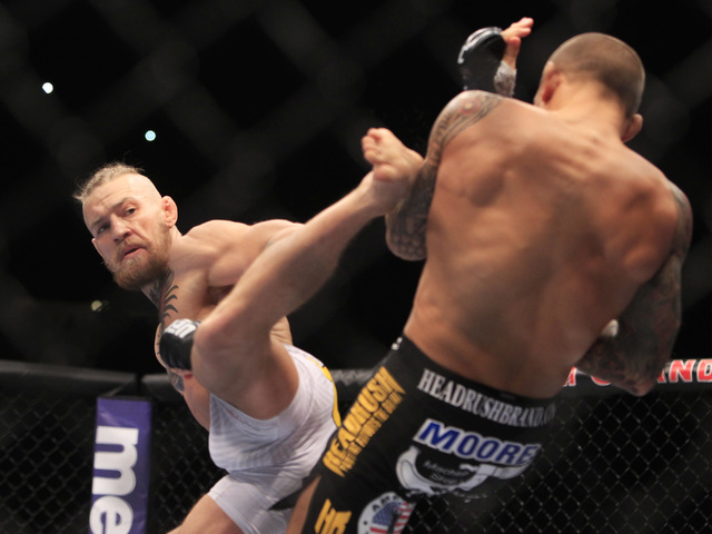 Conor McGregor throws a kick at Dustin Poirier during their fight at UFC 178 Saturday, Sept. 27, 2014 at the MGM Grand Garden Arena in Las Vegas. (Sam Morris/Las Vegas Review-Journal)