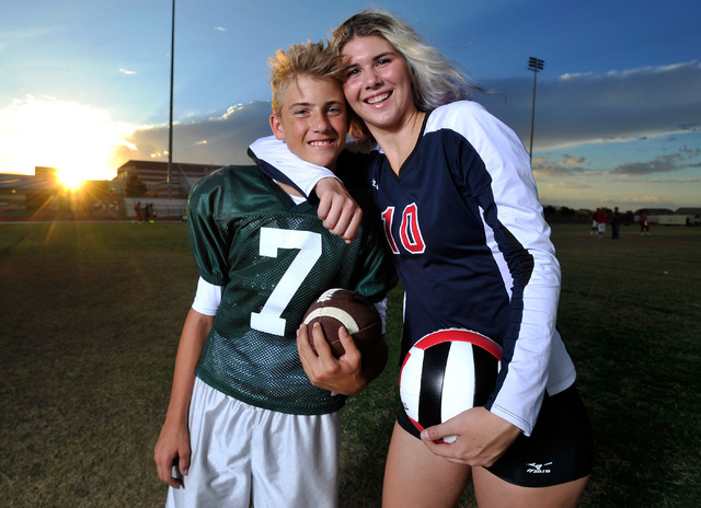 Brother and sister, Kenyon, left, and Berkeley Oblad, pose at Liberty High School on Tuesday, Sept. 16, 2014. Kenyon, a freshman, is the starting quarterback for Liberty's varsity football team.   ...