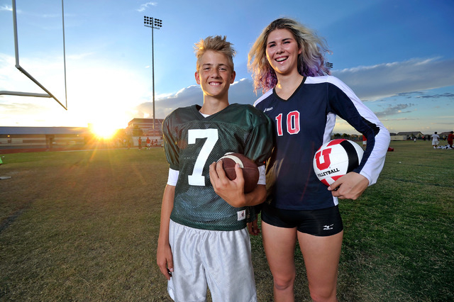 Brother and sister, Kenyon, left, and Berkeley Oblad, pose at Liberty High School on Tuesday, Sept. 16, 2014. Kenyon, a freshman, is the starting quarterback for Liberty's varsity football team.   ...