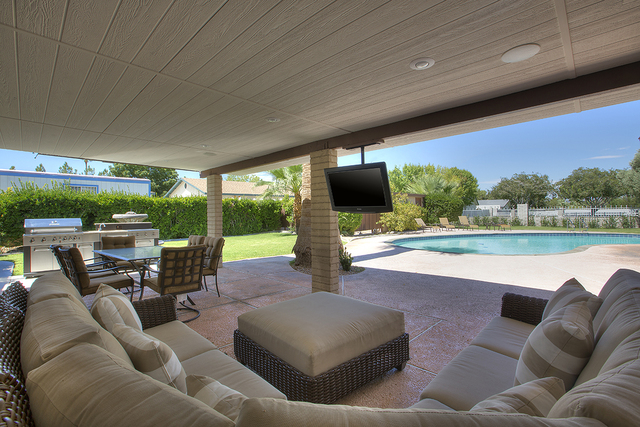 A guest home on the ranch features a backyard pool and patio.
