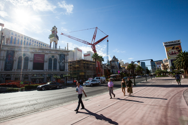 Pedestrians head north on the Strip as renovations go on at the Best Western Plus Casino Royale, center, in Las Vegas on Wednesday, Sept. 17, 2014. Northbound lanes on Las Vegas Boulevard were clo ...