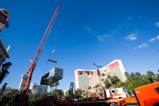 Part of a new central plant, lower left, is lifted by a crane as renovations go on at the Best Western Plus Casino Royale in Las Vegas on Wednesday, Sept. 17, 2014. Northbound lanes on Las Vegas B ...