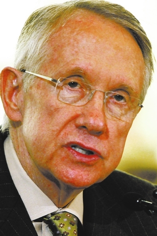 Senate Majority Leader Harry Reid, D-Nev., speaks to members of the U.S. Congressional Oversight Panel, which was recently put together to monitor the $700 billion federal bailout of the banking i ...