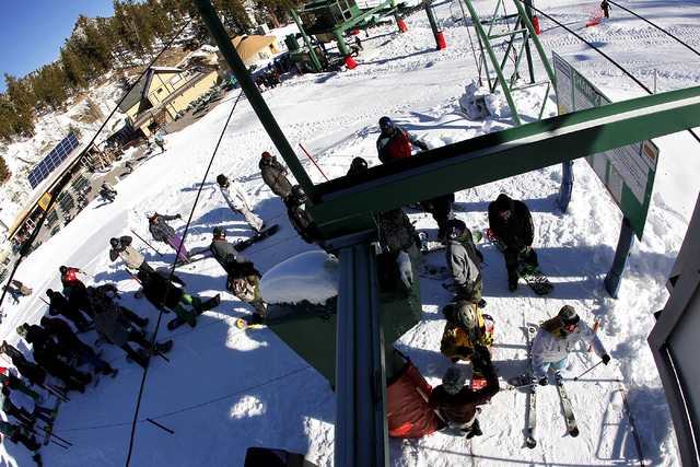 Riders get their tickets checked while waiting to load onto the chairlift during opening day at the Las Vegas Ski & Snowboard Resort on Mt. Charleston on Nov. 29, 2013. (Jason Bean /Las Vegas Revi ...