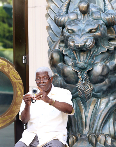 An unidetified tourist takes a picture near Caesars Palace Hotel & Casino on Las Vegas Boulevard on Friday, Sept. 26, 2014, in Las Vegas. (Bizu Tesfaye/Las Vegas Review-Journal)