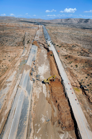 Road crews work to repair Interstate 15 in Moapa on Tuesday, Sept. 9, 2014. Record flooding on Monday caused major highway damage.  (Photo by David Becker/Las Vegas Review-Journal)