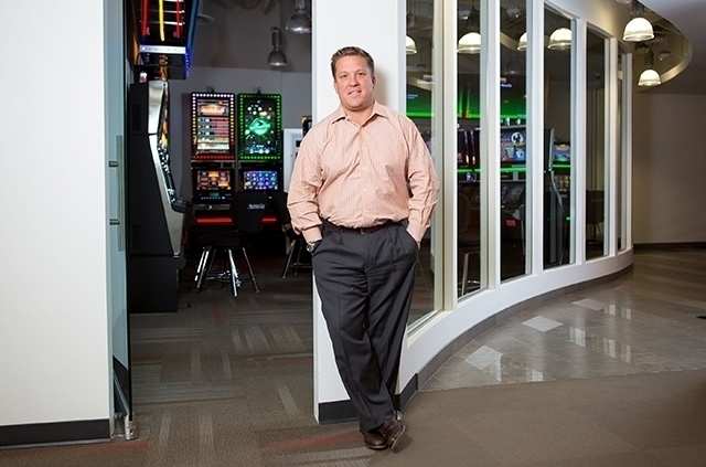 Patrick Ramsey, CEO of Multimedia Games, poses inside the slot machine maker's Tivoli Village office in July. (Samantha Clemens/Las Vegas Review-Journal)