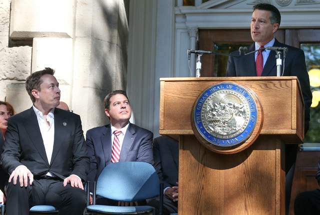 "Welcome to your new home, Mr. Musk!" says Gov. Brian Sandoval, outside Nevada's state capitol.