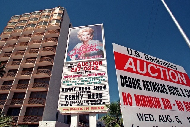 A sign outside the Debbie Reynolds hotel-casino in Las Vegas, Wednesday, Aug. 5, 1998, posts a bankruptcy auction of the property. The property was reportedly purchases for $9 million by a group r ...