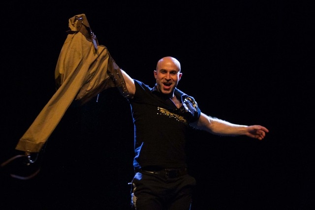 Magician Seth Grabel escapes from a straitjacket during his show "Variety Magic" at the Wolf Theater in the Clarion Hotel, located at 305 Convention Center Drive, in Las Vegas on Thursday, Dec. 27 ...