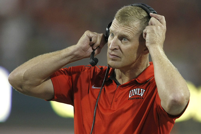 UNLV head coach Bobby Hauck during the first half of an NCAA college football game against Arizona, Friday, Aug. 29, 2014, in Tucson, Ariz. (AP Photo/Rick Scuteri)