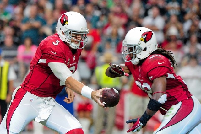 Arizona Cardinals quarterback Carson Palmer (3) hands off to running back Andre Ellington (38) during the second half against the Philadelphia Eagles at University of Phoenix Stadium. (Matt Kartoz ...