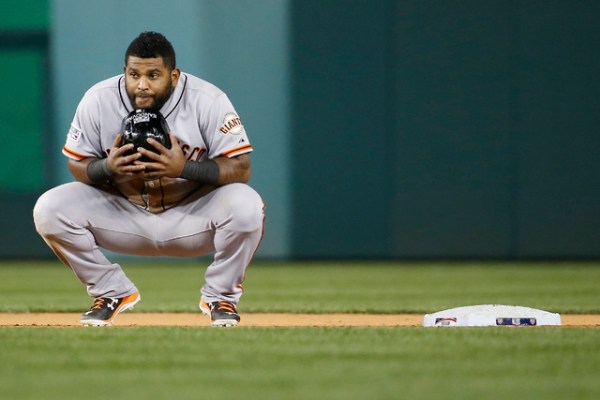 San Francisco Giants third baseman Pablo Sandoval (48) waits for the  umpires to review the play at the plate in the ninth inning of Game 2 of  baseball's NL Division Series against