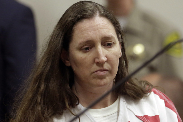 Megan Huntsman, accused of killing six of her newborn babies and storing their bodies in her garage, appears in court Monday, Oct. 20, 2014, in Provo, Utah. Huntsman made a brief court appearance ...