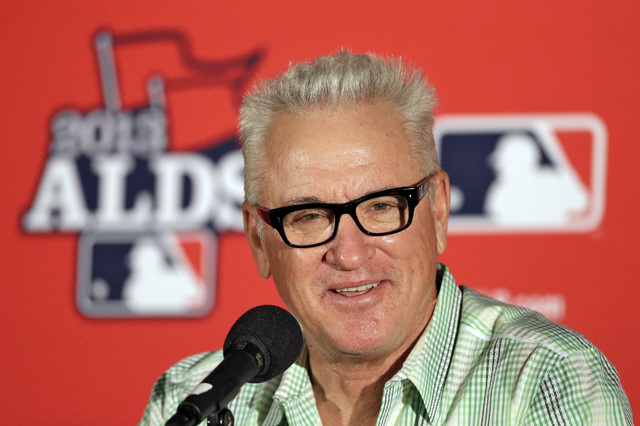 In this Oct. 6, 2013, file photo, Tampa Bay Rays manager Joe Maddon smiles during a news conference before Game 3 of baseball's American League division series against the Boston Red Sox in St. Pe ...