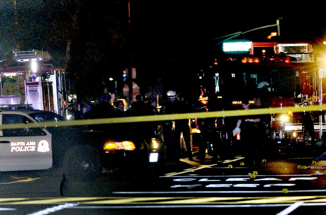 Police and emergency responders at the scene where three teenage girls trick-or-treating in costume were hit by a vehicle and killed while walking across a Southern California intersection in Sant ...