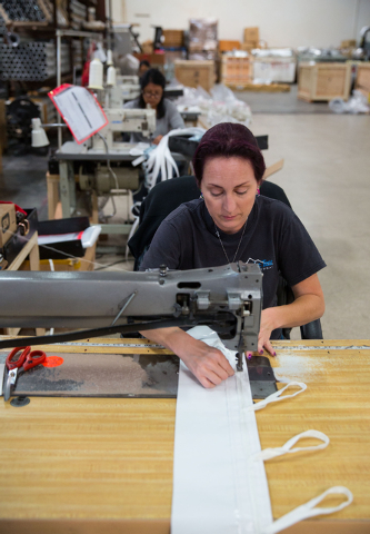 Janelle McMillan sews a doorway at Creative Tent International, located at 451 Mirror Court suite 101 in Henderson on Monday, Oct. 6, 2014. The 10-year-old business manufactures and installs perma ...