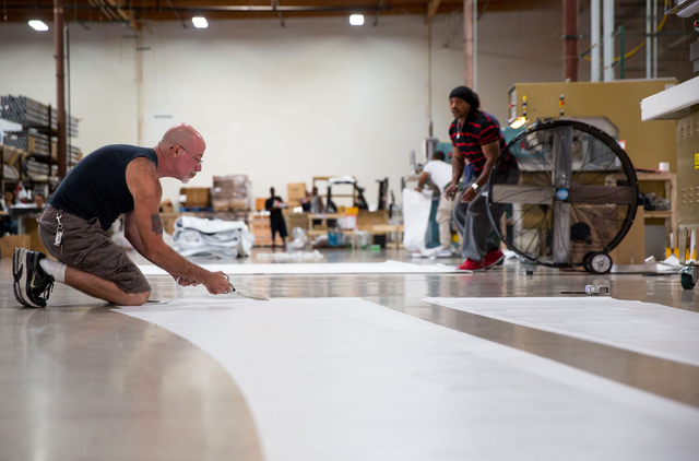 Charlie Little works at Creative Tent International, located at 451 Mirror Court suite 101 in Henderson on Monday, Oct. 6, 2014. The 10-year-old business manufactures and installs permanent and te ...