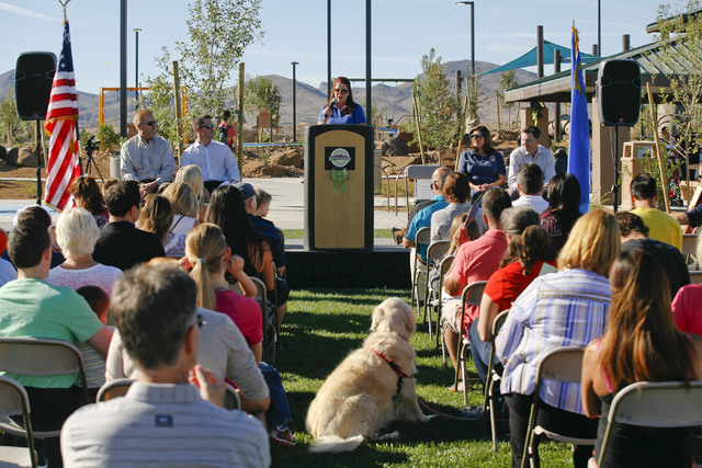Henderson Councilwoman Debra March speaks to a crowd at the grand opening of Capriola Park in Inspirada on Oct. 4. The $7 million park, 2155 Via Firenze, was funded by Inspirada Builders and is se ...