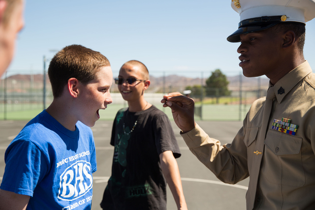 Alec Klasna, 14, left, takes direction from Ivorian Scott, right, as part of the Basic High School Junior ROTC program at the school Friday, Sept. 19, 2014. (Samantha Clemens-Kerbs/View)