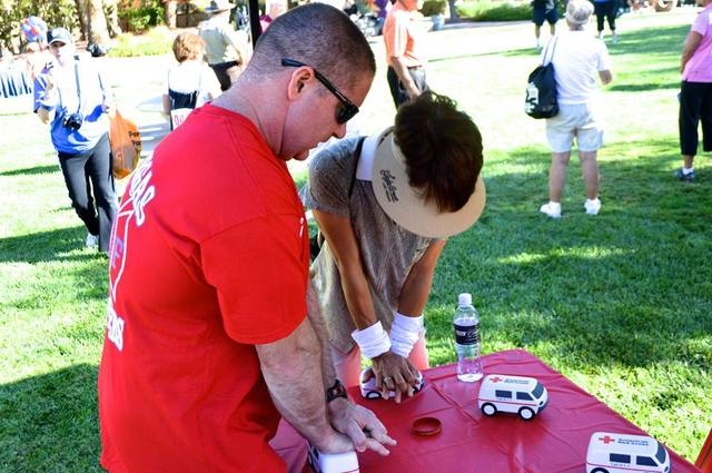 Las Vegas firefighters volunteered Oct. 11, 2014, to lead the warm-up for the Summerlin 5K Run & Fun Walk. After the run, they taught participants how to perform hands-only CPR and displayed infor ...