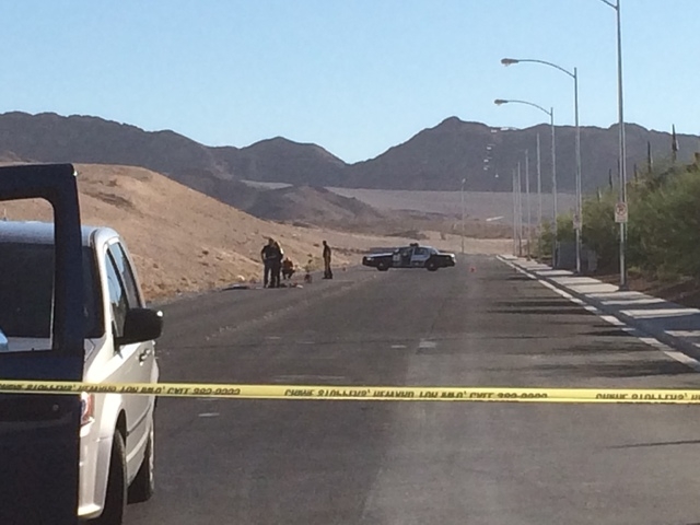 Las Vegas Police investigate an accident scene Friday, Oct. 31, 2014, near Sahara Avenue and Hollywood Boulevard. Two men sitting on the trunk of a car driven by a 19-year-old female were seriousl ...