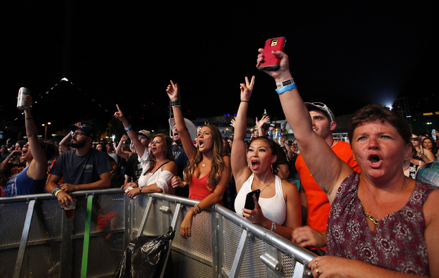 Fans cheer as Tyler Farr performs at the Route 91 Harvest country music festival at the MGM Resorts Village in Las Vegas on Sunday, October 5, 2014. (Justin Yurkanin/Las Vegas Review-Journal)