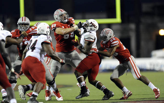 UNLV Rebels offensive lineman Brett Boyko (69) battles Northern Illinois defensive end Ladell Fleming (8) in the second half of their NCAA Football game at Sam Boyd Stadium in Las Vegas Saturday, ...