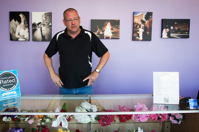 Jim McGinnis, owner of Chapelle De L'Amour, waits for couples at his wedding chapel located one block from the Clark County Marriage License Bureau on Wednesday, Oct. 8, 2014. On Thursday, Oct. 9, ...