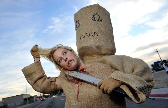 Erica Browning of Henderson, shows off her costume before the start of the 5th annual Halloween parade along East Fremont Street in Las Vegas on Friday, Oct. 31, 2014. (David Becker/Las Vegas Revi ...