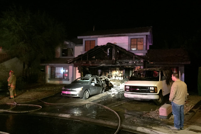 Two people escaped their home at 8913 Rocky Shore Dr., near Fort Apache and Desert Inn roads, early Friday morning, Oct. 31, 2014, after a fire started in the garage. The garage was gutted and fou ...