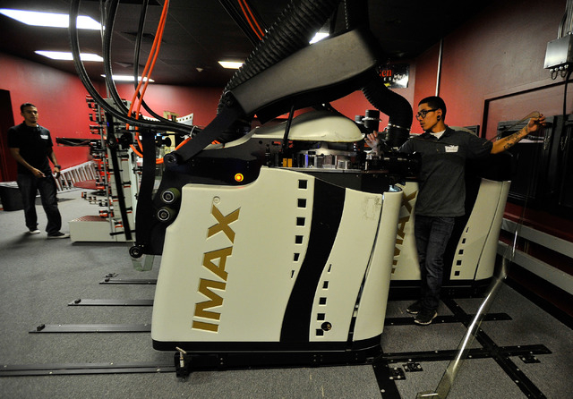 Projectionist Julian Attiya practices threading a 70mm film print at the Brenden Theatres inside the Palms hotel-casino Tuesday, Oct. 28, 2014. The Las Vegas movie theater will be showing the 70mm ...