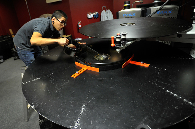 Projectionist Julian Attiya practices threading a 70mm film print at the Brenden Theatres inside the Palms hotel-casino Tuesday, Oct. 28, 2014. The Las Vegas movie theater will be showing the 70mm ...