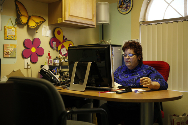 Linda Lera-Randle El works on a computer in her office at Straight from the Streets in Las Vegas Thursday, March 1, 2012. Lera-Randle El will receive an award from the American Society for Public  ...