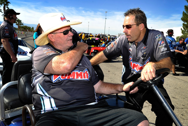 Team owner Ken Black, left, talks with driver, Greg Anderson before a qualifying session at the 14th annual NHRA Nationals at The Strip at the Las Vegas Motor Speedway on Friday, Oct. 31, 2014. (D ...