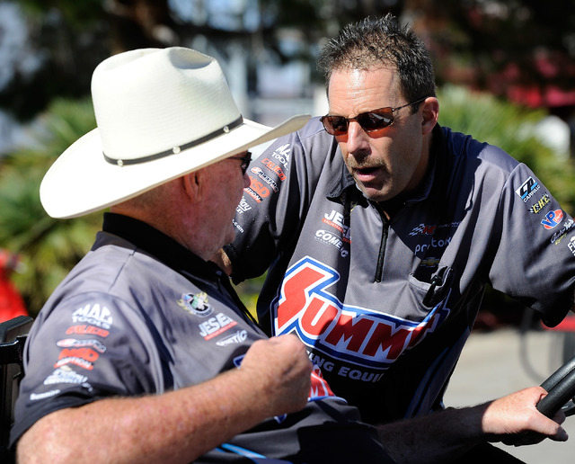 Team owner Ken Black, left, talks with driver, Greg Anderson before a qualifying session at the 14th annual NHRA Nationals at The Strip at the Las Vegas Motor Speedway on Friday, Oct. 31, 2014. (D ...