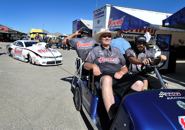 Team owner Ken Black, wearing his cowboy hat, is driven to the starting line before a pro stock qualifying session at the 14th annual NHRA Nationals at The Strip at the Las Vegas Motor Speedway on ...