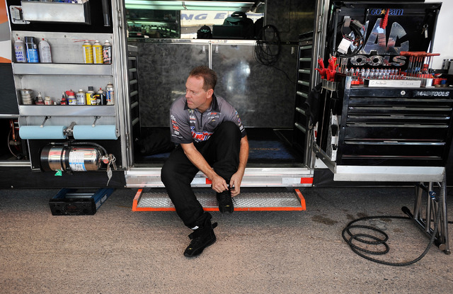 Driver Jason Line suits up  before a pro stock qualifying session at the 14th annual NHRA Nationals at The Strip at the Las Vegas Motor Speedway on Friday, Oct. 31, 2014. (David Becker/Las Vegas R ...