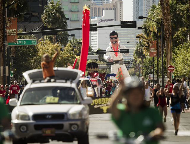 Participants march in the  Nevada Day Parade on Fourth Street in downtown Las Vegas on Friday, Oct. 31. Thousands lined the street to celebrate Nevada's  Sesquicentennial. (Jeff Scheid/Las Vegas R ...