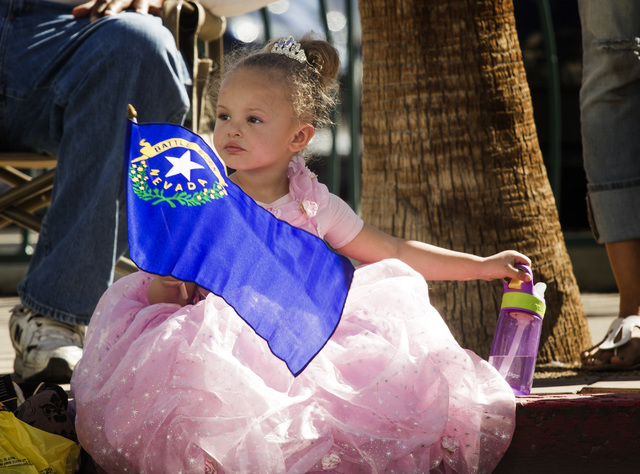 Madison Smith, 3, watches the Nevada Day Parade on Fourth Street in downtown Las Vegas on Friday, Oct. 31. Thousands lined the street to celebrate Nevada's Sesquicentennial. (Jeff Scheid/Las Vega ...